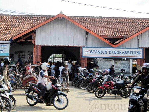 Bandung station railway trains indonesia bridges passenger stopped platforms sunset track another two over